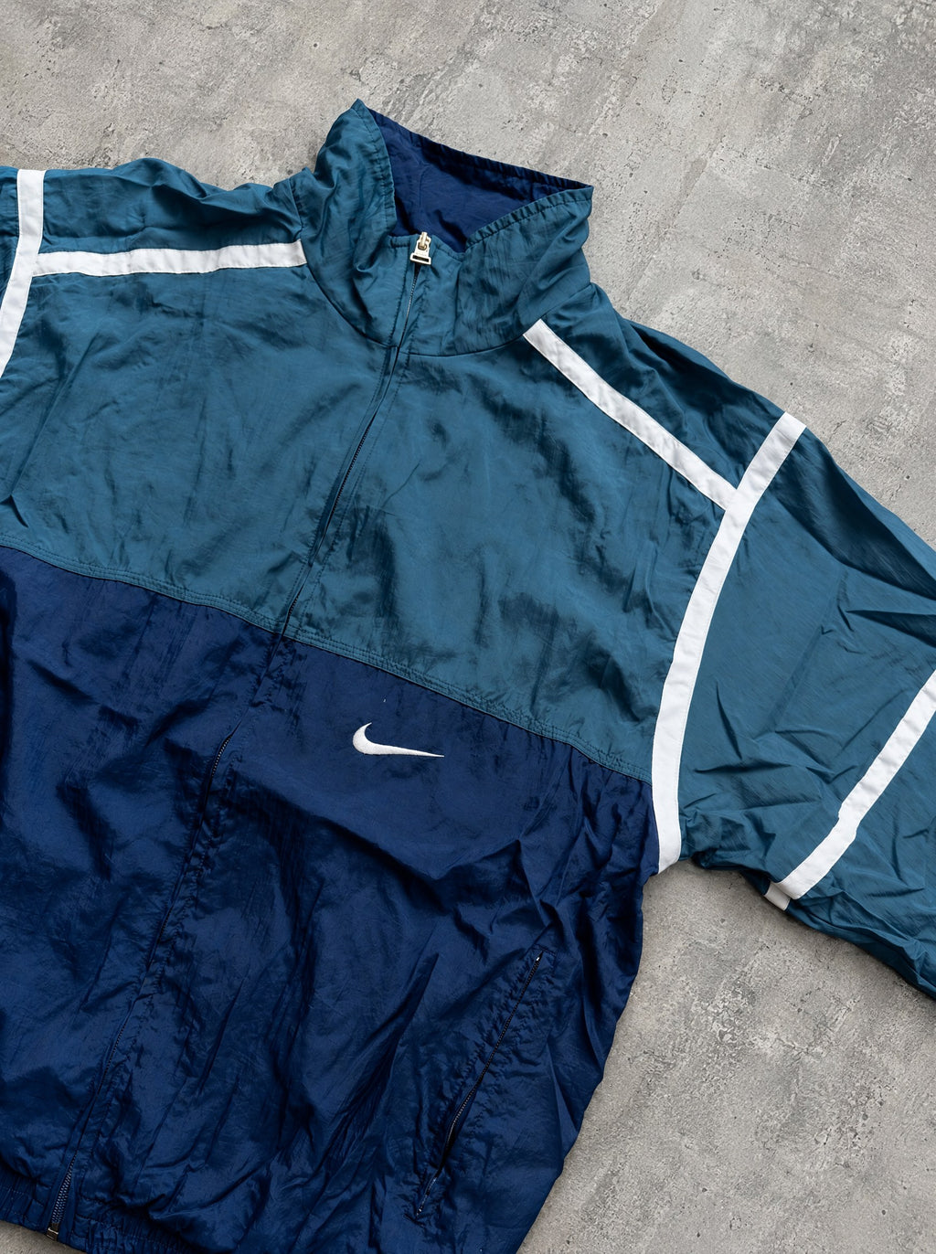 Rompevientos Nike 90s verde petróleo y azul marino