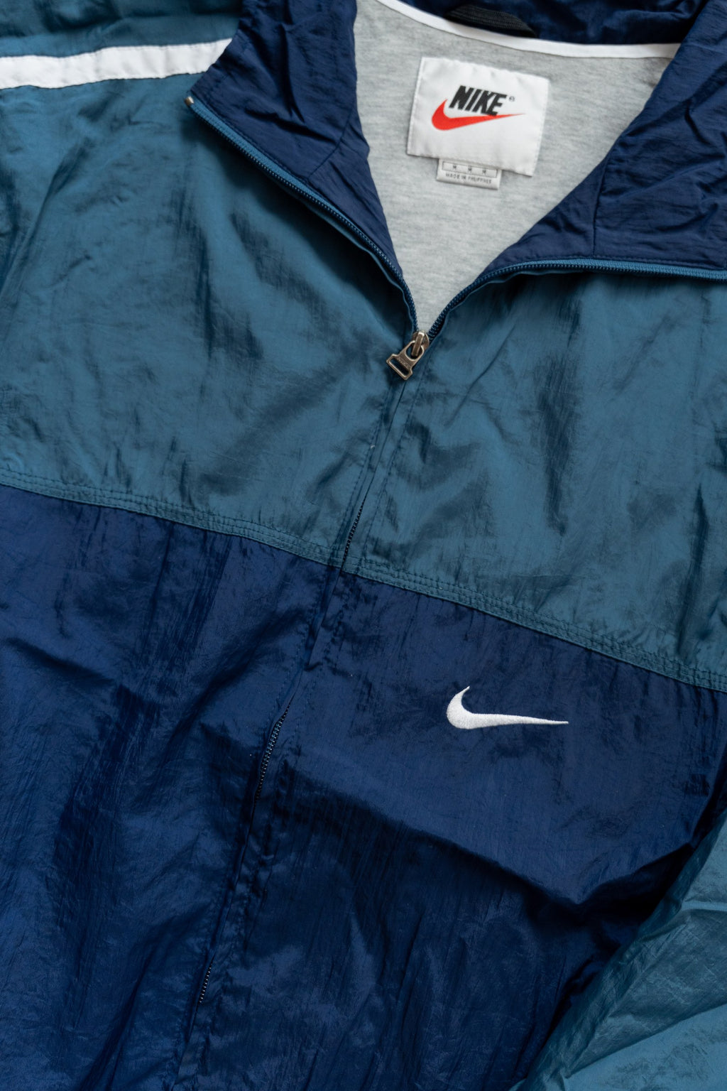Rompevientos Nike 90s verde petróleo y azul marino