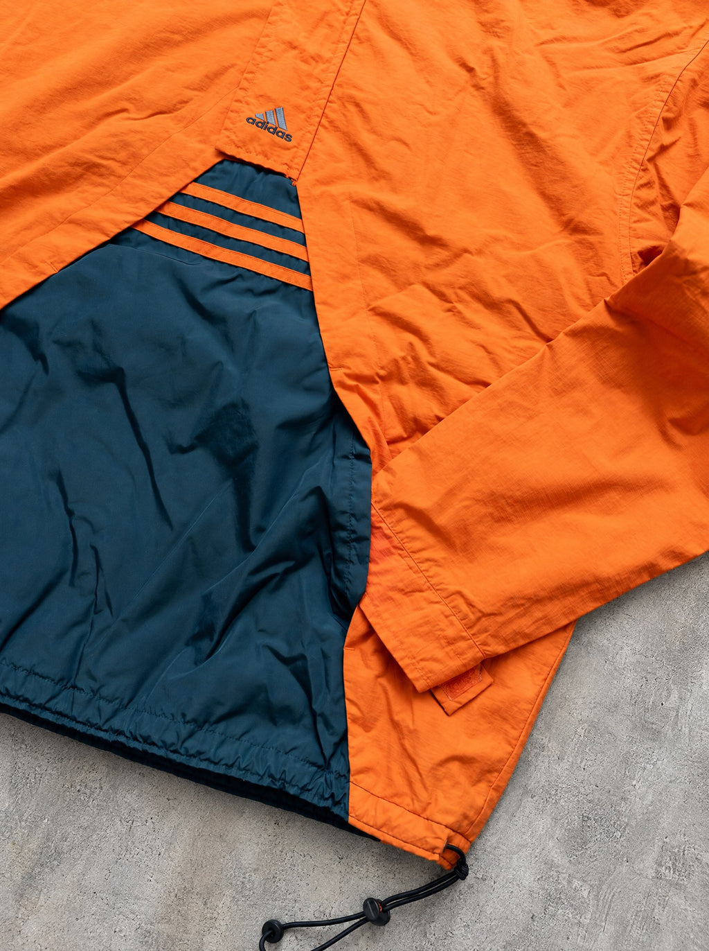 Anorak Adidas Half-Zip 90s naranja y azul petróleo