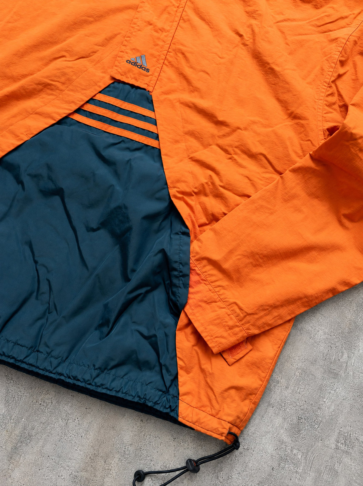 Anorak Adidas Half-Zip 90s naranja y azul petróleo