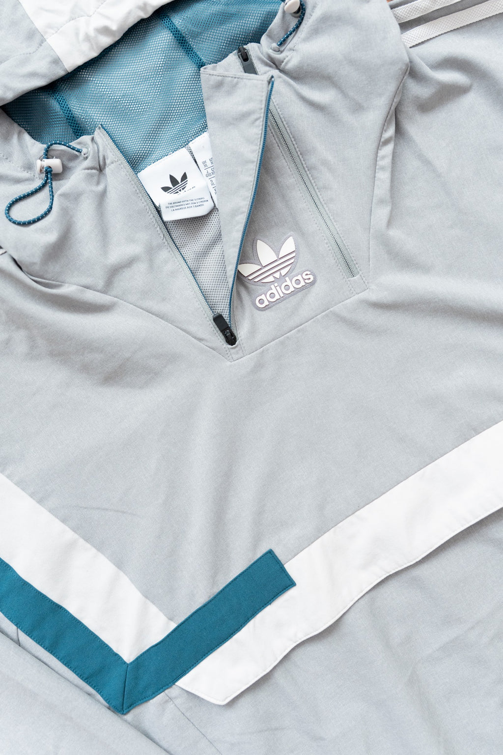 Anorak Adidas Originals gris y verde petróleo