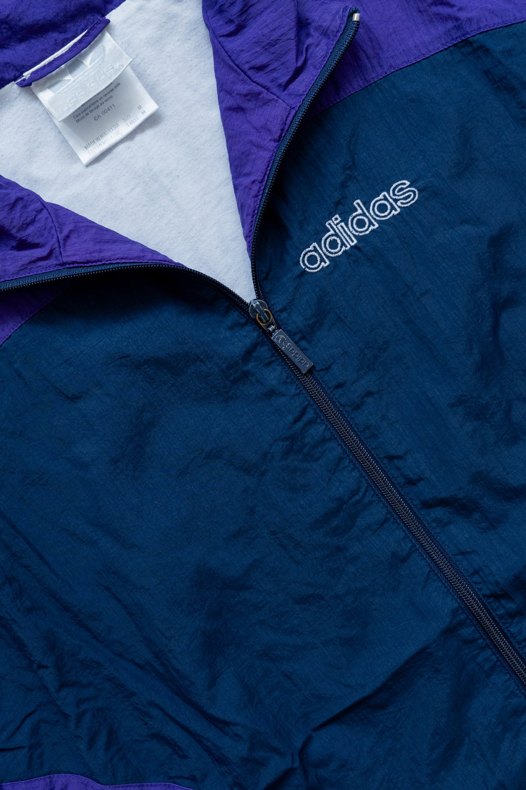 Rompevientos Adidas Originals 90s violeta y azul petróleo